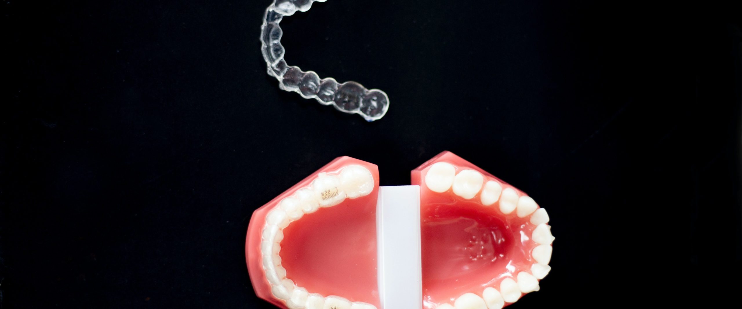 Dental mouth guard next to teeth